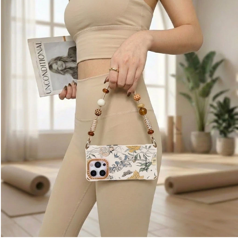 beige floral phone case with beaded strap – handbag carry lifestyle