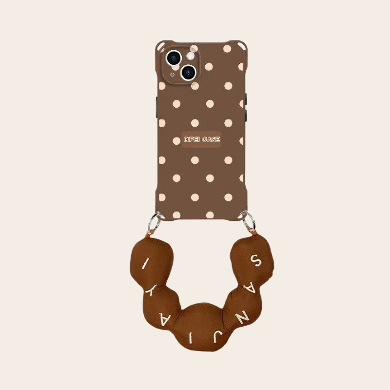 polka dot phone case brown with puffy letter ball strap – flatlay